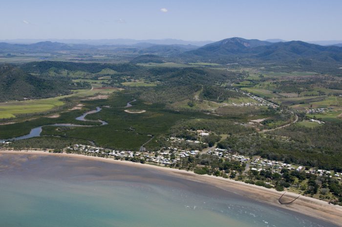 The calm beach and the lush hinterland at Seaforth.